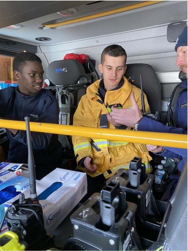 Brandon and Joshua helped Lieutenant Robertson with a radio check